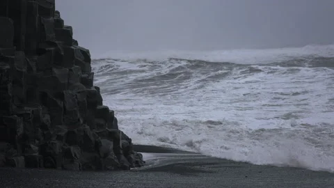 Sea Stack On Black Sand Beach With Crashing Waves Video stock 182142693