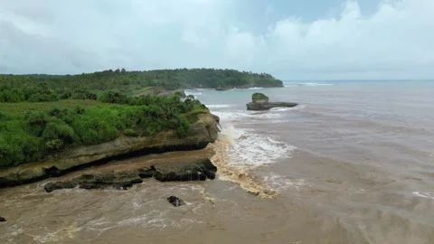 Sea stack cliff at ujung genteng west java Stock Footage 241149215