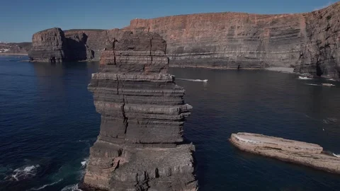 Sea stack close orbit at Vila Nova de Mil Fontes falésias Alentejo Portugal Stock Footage 331568107