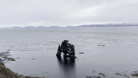 Sea stack landmark Iceland waves crashing and breaking in Iceland ocean  4k hdr Stock Footage 279026296