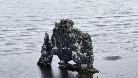 Sea stack landmark Iceland waves crashing and breaking in Iceland ocean  4k hdr Stock Footage 279026698
