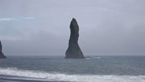 Sea Stack Rising from Atlantic Ocean Stock Footage 320565567