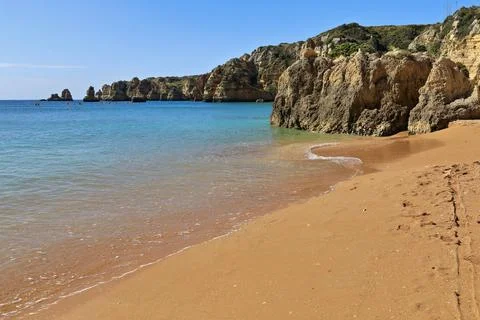 Sea stack rock formation-Praia de Dona Ana Beach. Lagos-PT Stock Photos