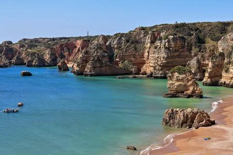 Sea stack rock formations-Praia de Dona Ana Beach. Lagos-PT Stock Photos