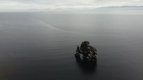Sea Stack Silhouette in the Mist Stock Photos