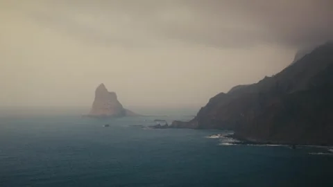 Sea Stack Silhouetted in Misty Light Near Benijo, Anaga, Tenerife, Spain Stock Footage 346288942