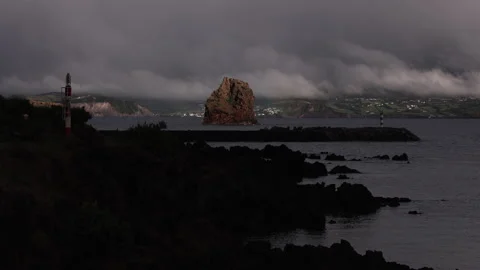 Sea Stack in Sunlight. Atlanticoline Ferry coming into Port. Stock-Footage 238404131