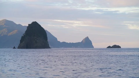 Sea stack at sunrise on a quite summer morning, Izu Peninsula, Japan Stock Footage 118485329