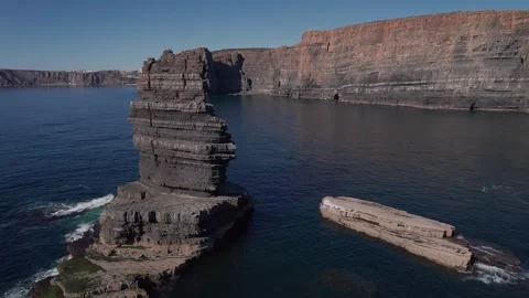 Sea stack at Vila Nova de Mil Fontes falésias Alentejo Portugal drone push in Stock Footage 331567055