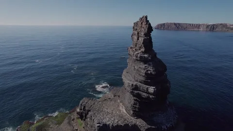 Sea stack at Vila Nova de Mil Fontes Alentejo Portugal Atlantic coast drone Stock Footage 331567476