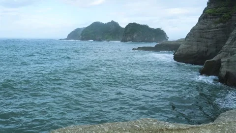 Sea stacks and dramatic clouds in Izu peninsula, Shizuoka Prefecture, Japan Video stock 249639360