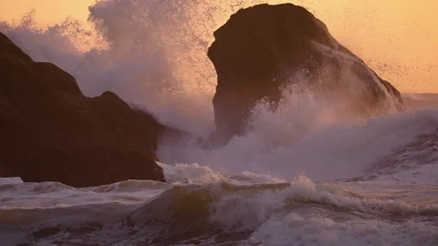 Sea Stacks Hit By Foamy Waves On Sunset Beach. Slow Motion Stock Footage 257662226