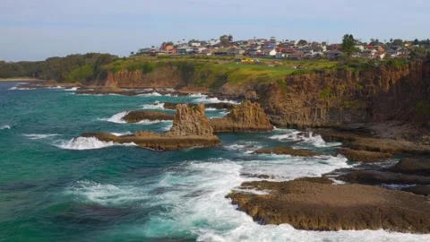 Sea Stacks With Splashing Waves At Cathedral Rocks Near Coastal Town In Video stock 156228586