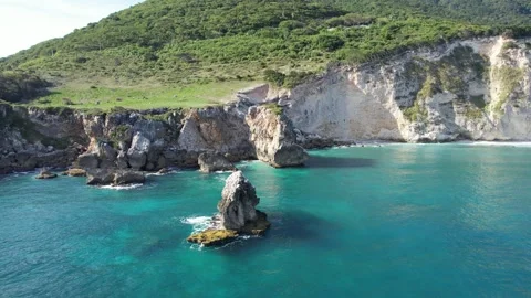 Sea stacks in turquoise water below white cliffs, aerial view Stock Footage 278368749