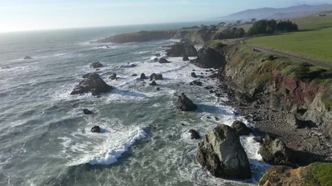 Sea stacks with waves along cliff 스톡 동영상 149719309