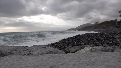 SEA IN STORM AND CLOUDY SKY WITH WAVES INVADING THE BEACH Stock Footage 100898077