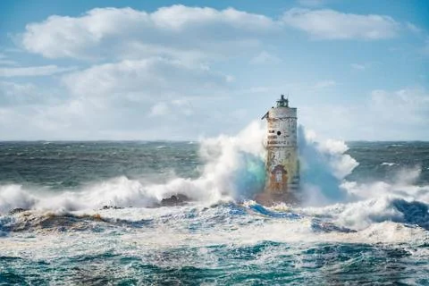 Sea storm on Lighthouse Mangiabarche situated in Calasetta, Sardinia, Italy. Stock Photos