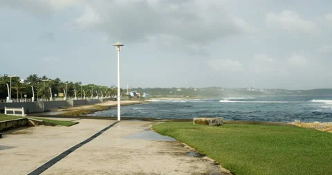 Sea with stormy clouds with wind over the ocean on the beach, waves crashing Stock Footage 103298357