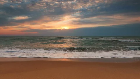 Sea sunrise over the beach with dramatic cloudscape Stock Footage 139218666