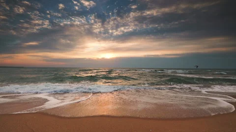 Sea sunrise over the beach with dramatic cloudscape Stock Footage 139219507