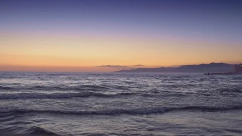 Sea sunset near the mountains Stock Footage 123789739