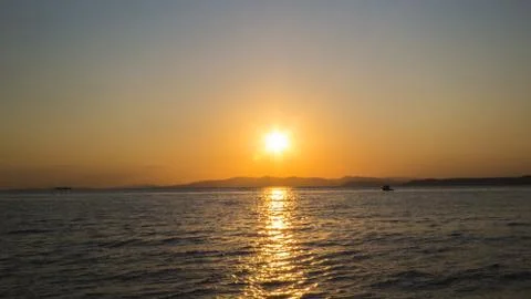 Sea at sunset Stock Photos