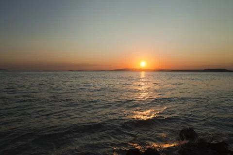 Sea at sunset Stock Photos