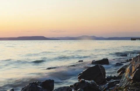 Sea at sunset Stock Photos