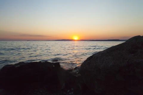 Sea at sunset Stock Photos