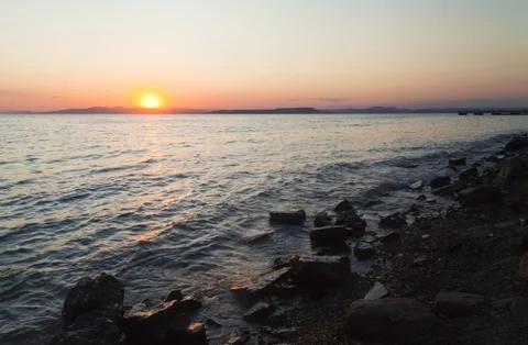 Sea at sunset Stock Photos
