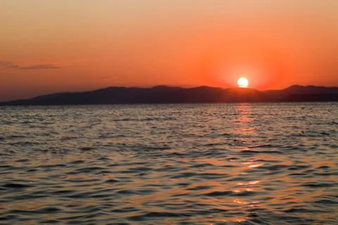 Sea at sunset Stock Photos