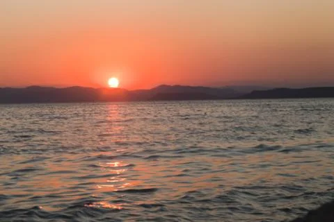 Sea at sunset Stock Photos