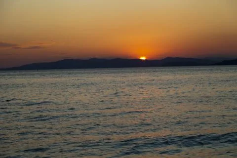 Sea at sunset Stock Photos