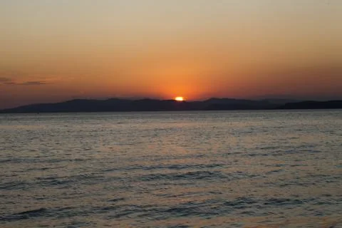 Sea at sunset Stock Photos