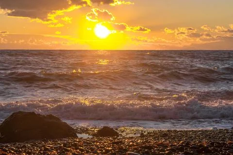 Sea at sunset Stock Photos