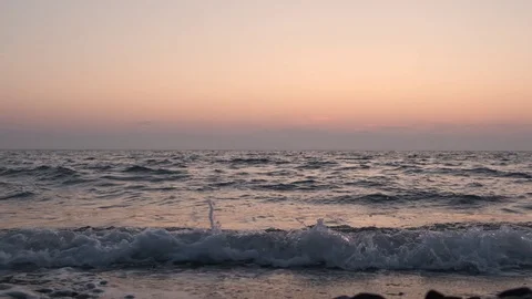Sea at sunset, slow motion. Waves at sunset. Stock Footage 118645180