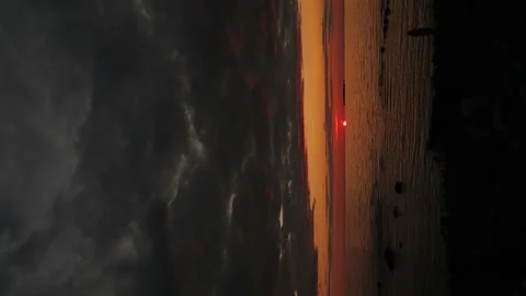 At Sea Sunset The Sun Goes Down Below The Horizon Under Dark Black Clouds Stock Footage 168173927