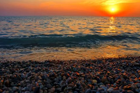 Sea sunset. The sun sets behind the horizon. Stock Photos