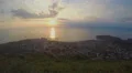 Sea sunset timelapse, unforgettable view on city located in mountains, tourism 4k or 4k+ Resolution