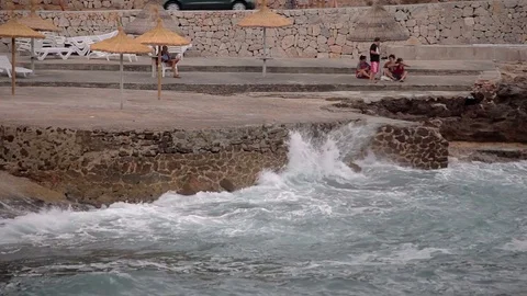 The sea surf in the bay on a cloudy day. A small storm. Polenca and Port. Cala Stock Footage 76490400