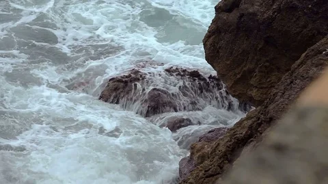 The sea surf in the bay on a cloudy day. A small storm. Polenca and Port Stock Footage 76491811