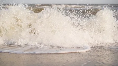 Sea surf, foamy waves breaking on the sandy shore on summer. Aesthetic seascape Video stock 252689194
