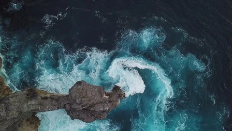 Sea surf footage from above. Cliffs and the ocean. Aerial drone shooting. Stock Footage 100712151