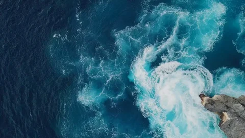 Sea surf footage from above. Cliffs and the ocean. Aerial drone shooting. Stock Footage 100712669