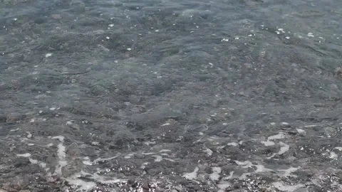 Sea surf on the pebbles close-up relax Stock Footage 165843574