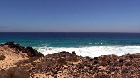 Sea surf on the rocks in the area  Punta Pesebre  on Fuerteventura 库存影片 54230191