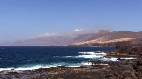 Sea surf on the rocks in the area  Punta Pesebre  on Fuerteventura Stock Footage 54230646