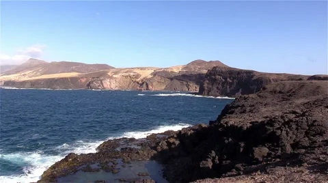Sea surf on the rocks in the area  Punta Pesebre  on Fuerteventura Stock Footage 54230752