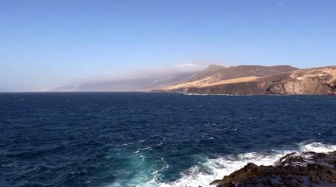 Sea surf on the rocks in the area  Punta Pesebre  on Fuerteventura Stock Footage 54241047