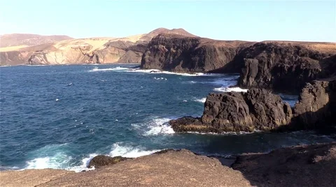 Sea surf on the rocks in the area  Punta Pesebre  on Fuerteventura 库存影片 54241243